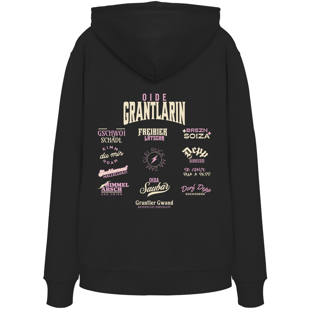 Schwarzer Oversize Hoodie mit großem Backprint „Oide Grantlarin“ und verschiedenen bayerischen Dialektbegriffen wie Gschwoi Schädl, Freibier Låtschn, Brezn Soiza, Oida Saubär und Dorf Depp von Grantler Gwand.