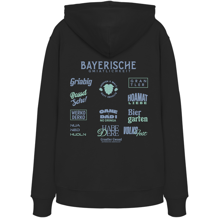 Schwarzer Bayerische Gmiatlichkeit Hoodie mit großem grünem Backprint und typischen bayerischen Begriffen wie Hoamatliebe, Biergarten, Grantler und Hopfen &amp; Malz. Unisex Kapuzenhoodie im modernen Streetwear-Look für Freizeit, Volksfest und Biergarten. Designed und bedruckt in Bayern von Grantler Gwand.