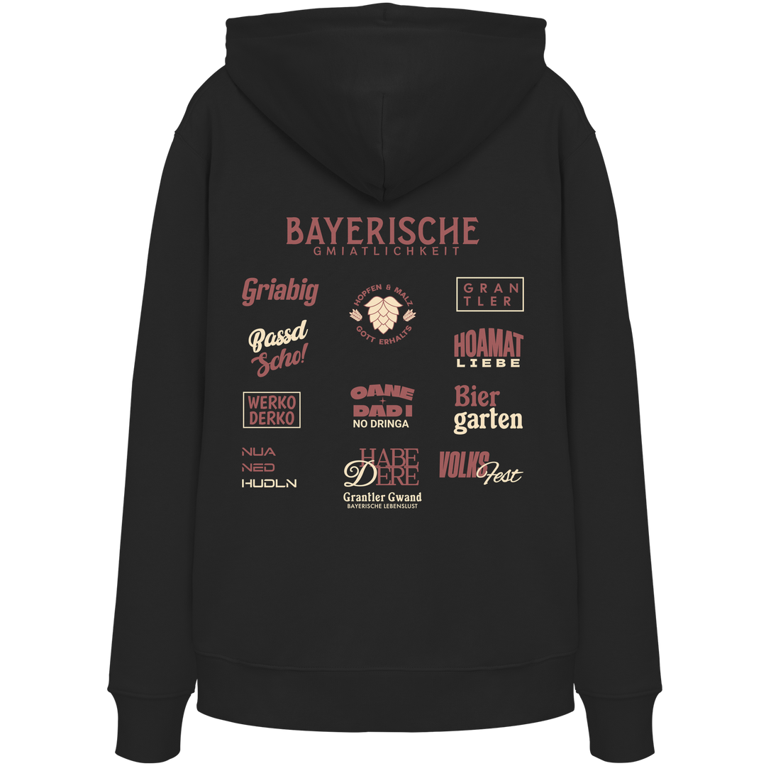 Schwarzer Unisex Hoodie mit großem rotem Backprint „Bayerische Gmiatlichkeit“ und typischen bayerischen Begriffen wie Hoamatliebe, Biergarten, Volksfest, Grantler, Hopfen & Malz und Griabig. Unisex Premium-Hoodie mit Kapuze im modernen Streetwear-Style. Designed und bedruckt in Bayern von Grantler Gwand.