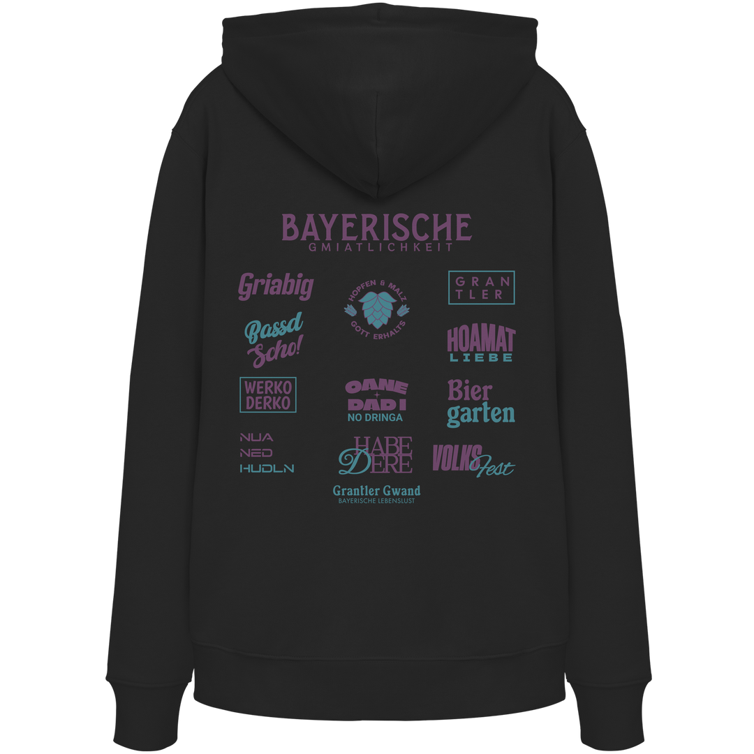 Schwarzer Hoodie mit großem lila Backprint „Bayerische Gmiatlichkeit“ und bayerischen Begriffen wie Hoamatliebe, Biergarten, Volksfest, Grantler, Hopfen & Malz und Griabig. Unisex Premium-Hoodie mit Kapuze im modernen Streetwear-Style. Designed und bedruckt in Bayern von Grantler Gwand.