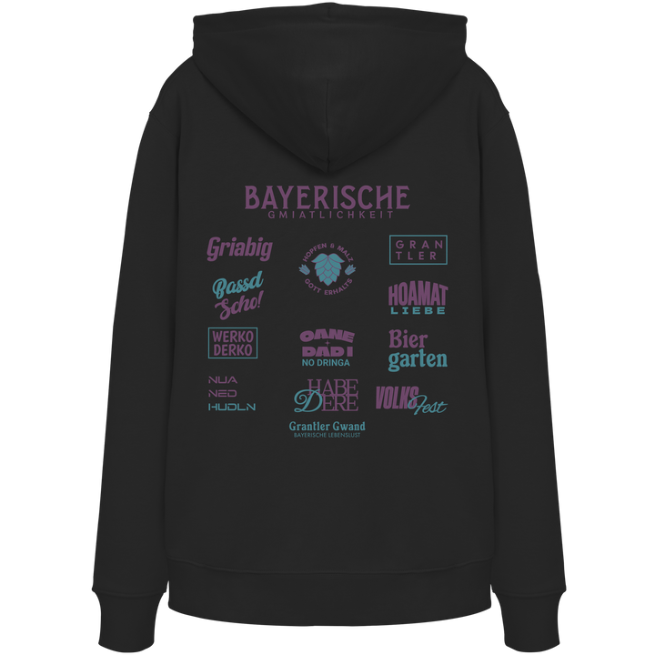 Schwarzer Hoodie mit großem lila Backprint „Bayerische Gmiatlichkeit“ und bayerischen Begriffen wie Hoamatliebe, Biergarten, Volksfest, Grantler, Hopfen &amp; Malz und Griabig. Unisex Premium-Hoodie mit Kapuze im modernen Streetwear-Style. Designed und bedruckt in Bayern von Grantler Gwand.