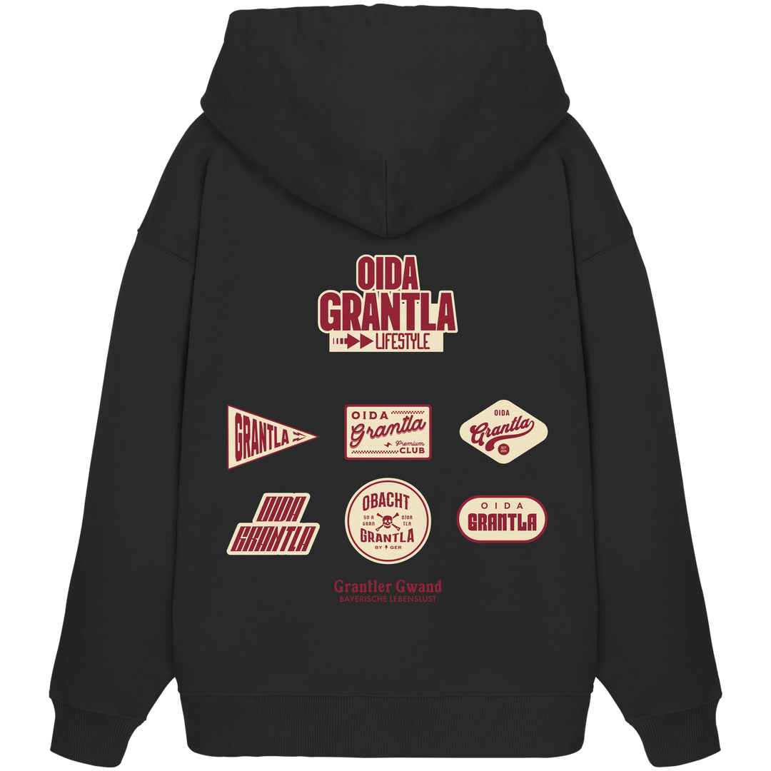 Schwarzer Oversize Hoodie mit großem Oida Grantla Lifestyle Backprint aus mehreren Retro-Logos im bayerischen Streetwear-Design von Grantler Gwand.