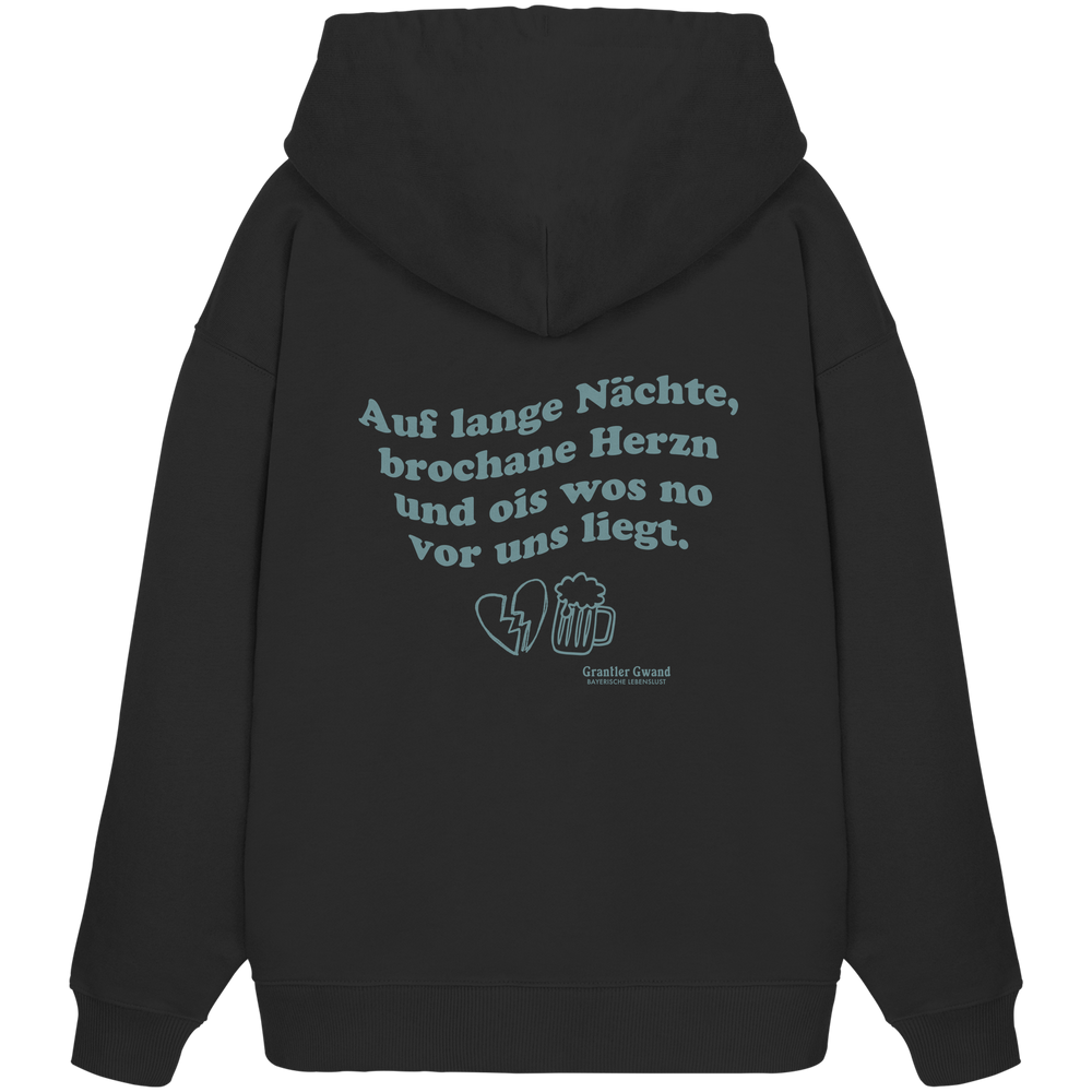 Schwarzer, schwerer Oversize Hoodie mit grünem Rückendruck „auf lange Nächte“ im Vintage-Look von Grantler Gwand aus hochwertiger Bio-Baumwolle.
