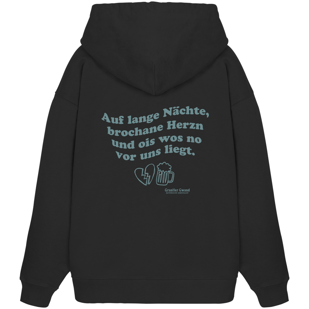 Schwarzer, schwerer Oversize Hoodie mit grünem Rückendruck „auf lange Nächte“ im Vintage-Look von Grantler Gwand aus hochwertiger Bio-Baumwolle.
