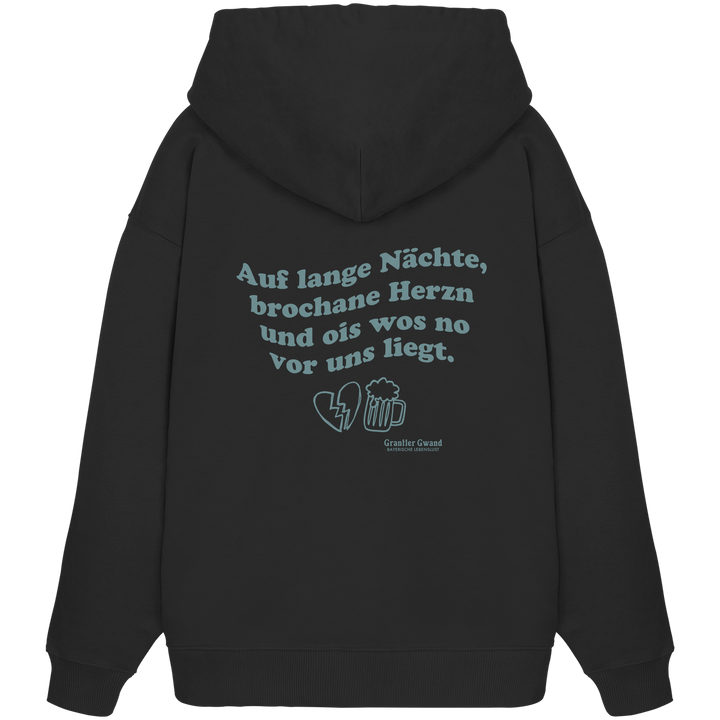 Schwarzer, schwerer Oversize Hoodie mit grünem Rückendruck „auf lange Nächte“ im Vintage-Look von Grantler Gwand aus hochwertiger Bio-Baumwolle.
