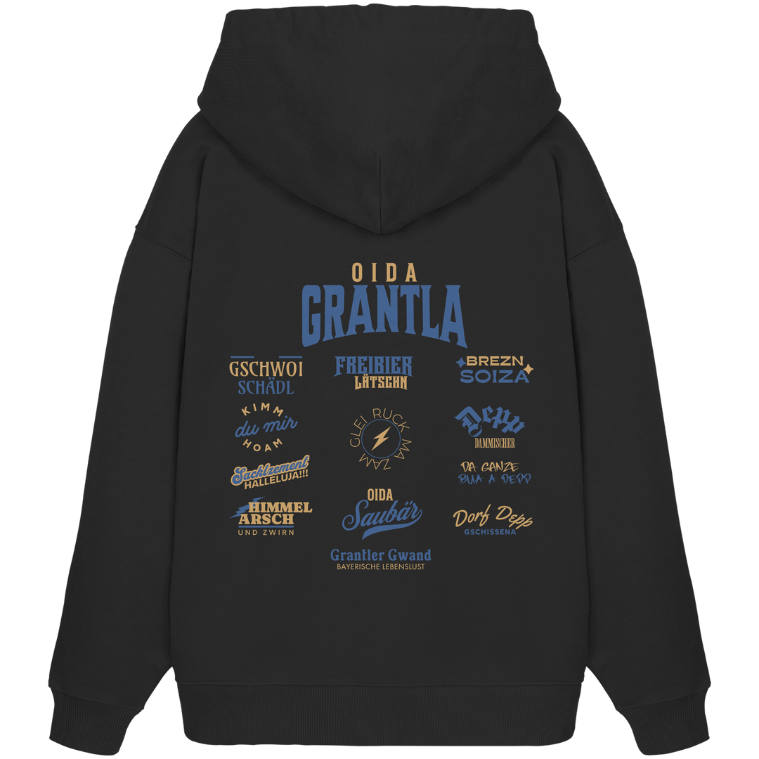 Schwarzer Oversize Hoodie mit großem Backprint „Oida Grantla“ und verschiedenen bayerischen Dialektbegriffen wie Gschwoi Schädl, Freibier Låtschn, Brezn Soiza, Oida Saubär und Dorf Depp von Grantler Gwand.