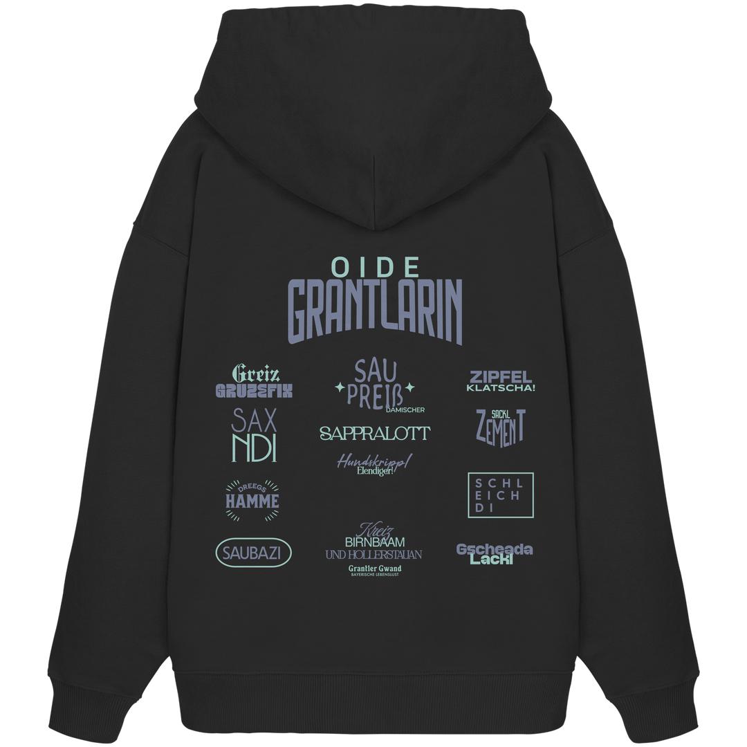 Schwarzer Oversize Hoodie mit großem Backprint „Oide Grantlarin“ sowie verschiedenen bayerischen Dialektbegriffen wie Sapperlott, Saubazi, Saxndi und Gscheada Lackl von Grantler Gwand.