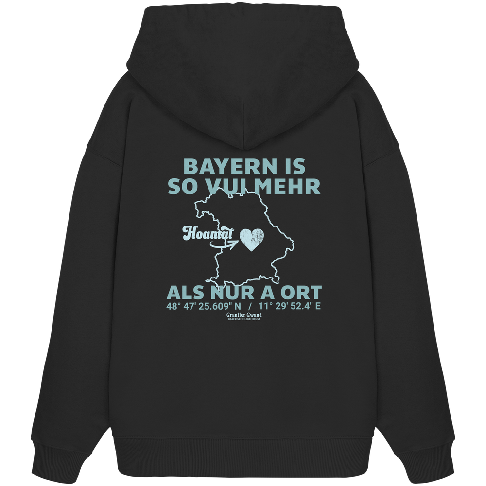 Schwarzer Oversize Hoodie in schwerer Qualität von Grantler Gwand mit grünem Backprint „Bayern im Herzen“ und Bayern-Silhouette – bayerischer Streetwear Hoodie im Oversize-Schnitt.