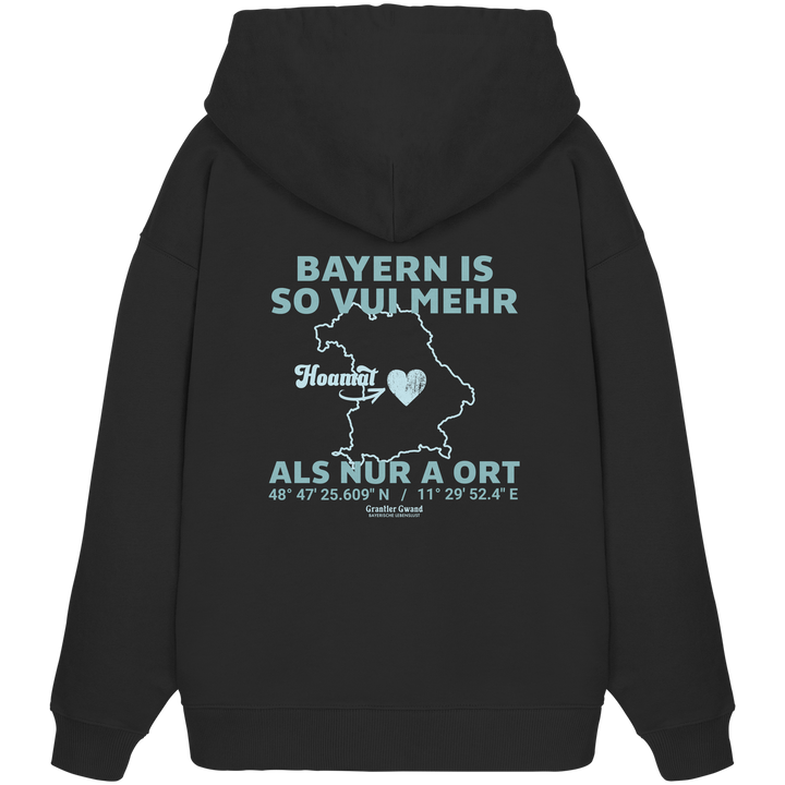 Schwarzer Oversize Hoodie in schwerer Qualität von Grantler Gwand mit grünem Backprint „Bayern im Herzen“ und Bayern-Silhouette – bayerischer Streetwear Hoodie im Oversize-Schnitt.