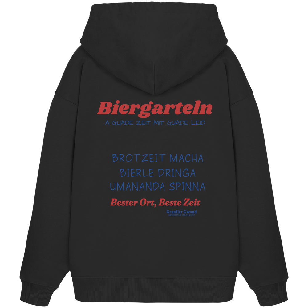 Schwarzer Oversize Hoodie mit großem Biergarteln Backprint in Rot und Blau sowie bayerischem Statement „A guade Zeit mit guade Leid“ – extra schwerer Premium Hoodie für Biergarten, Volksfest und moderne bayerische Streetwear von Grantler Gwand.