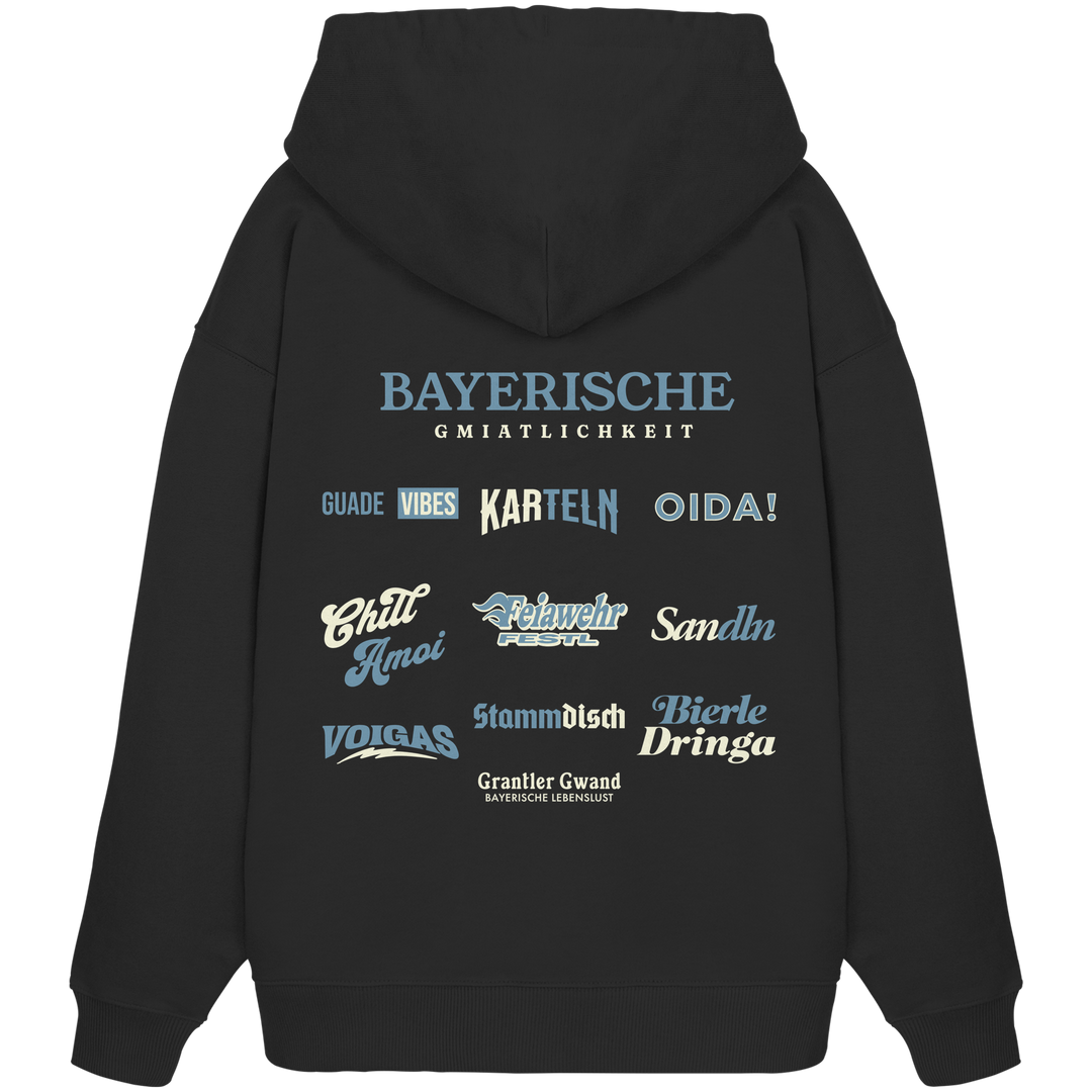 Schwarzer Oversize Hoodie mit großem Backprint "Bayerische Gmiatlichkeit" und verschiedenen bayerischen Begriffen wie Oida, Karteln, Stammdisch und Bierle Dringa von Grantler Gwand.