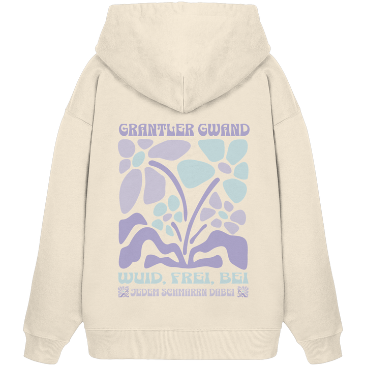 Naturfarbener Oversize Hoodie mit großem Retro-Blumen-Backprint und dem bayerischen Schriftzug „Wuid, Frei, Bei Jedem Schmarrn Dabei“ von Grantler Gwand.