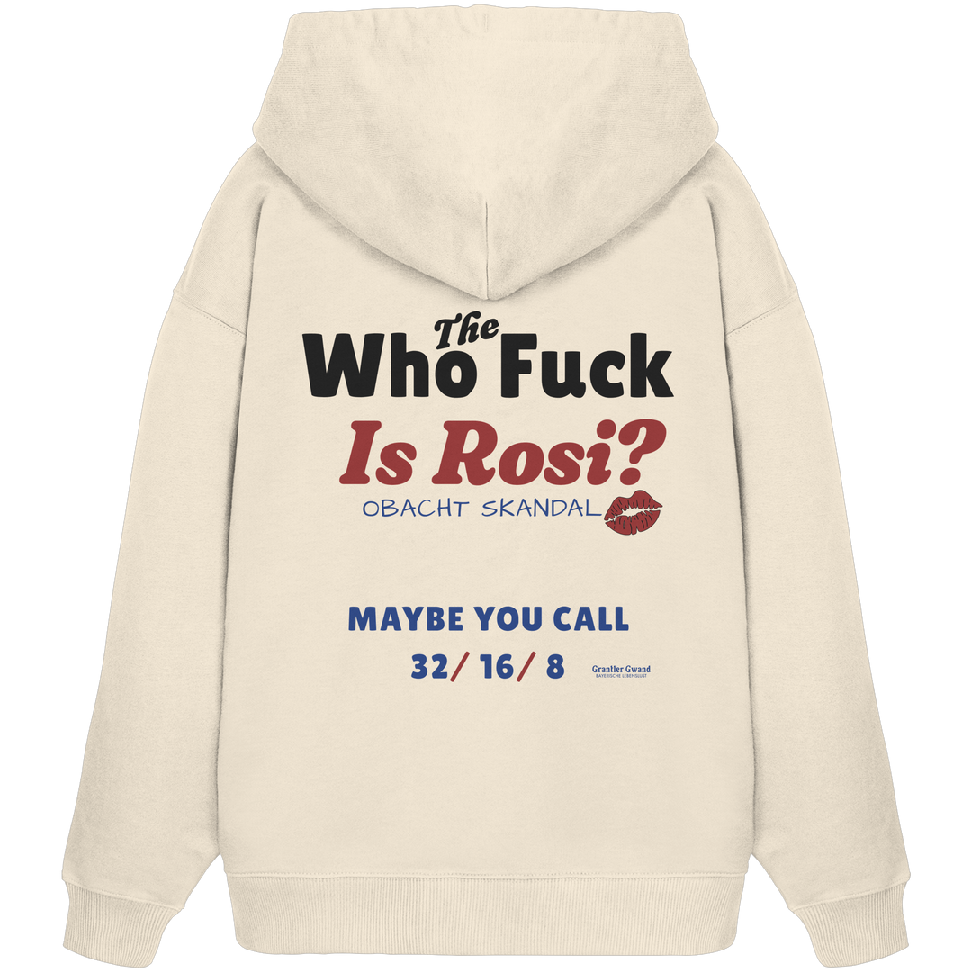 Beiger Oversize-Hoodie mit großem Backprint „Who The Fuck Is Rosi?“ im humorvollen Typografie-Design. Moderner bayerischer Streetwear-Hoodie für Volksfest, Biergarten und gesellige Abende. Extra schwerer Premium-Hoodie, designed und bedruckt in Bayern von Grantler Gwand.