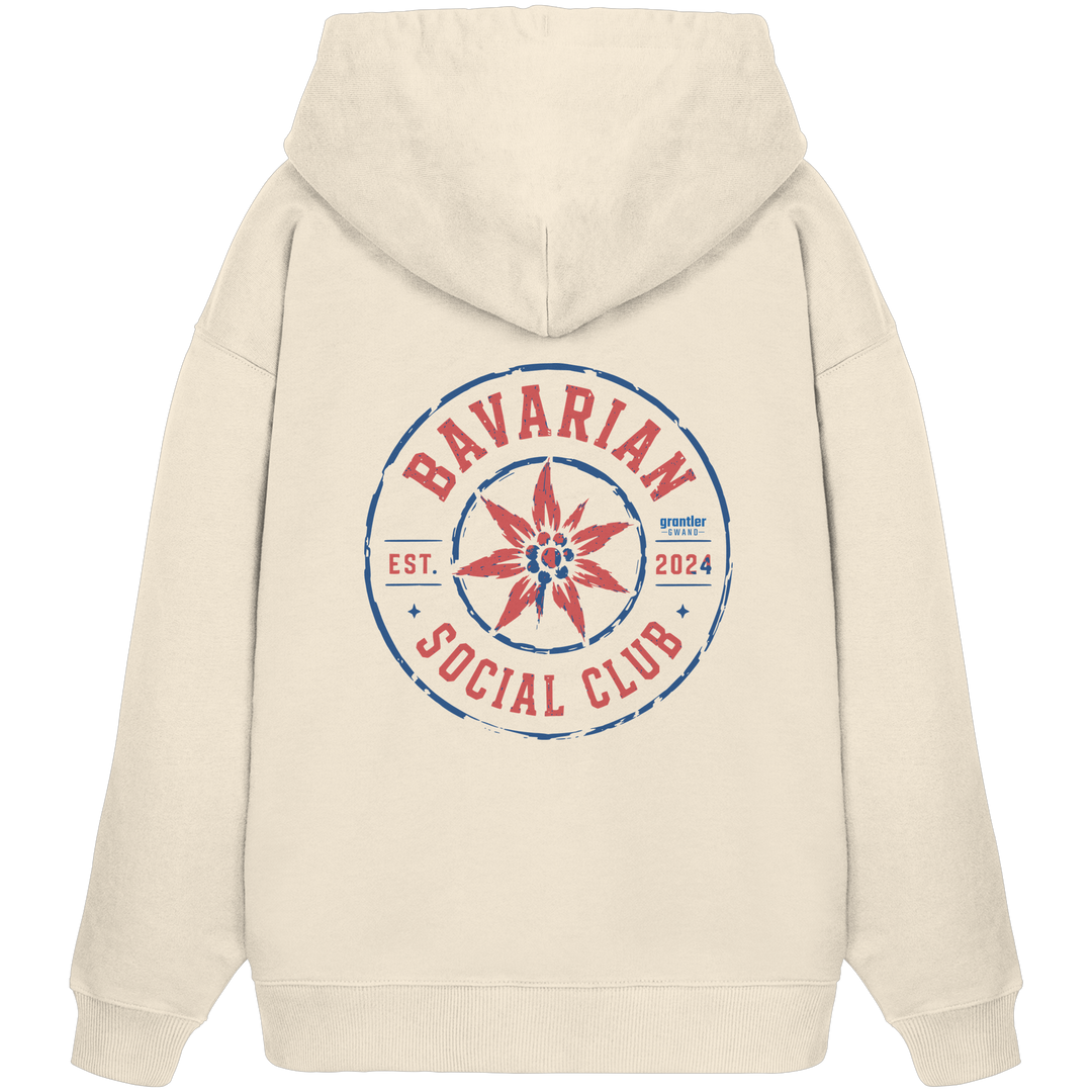 Naturfarbener Oversize Hoodie mit großem roten und blauen „Bavarian Social Club“-Backprint sowie Edelweiß-Motiv im Vintage-Streetwear-Design.