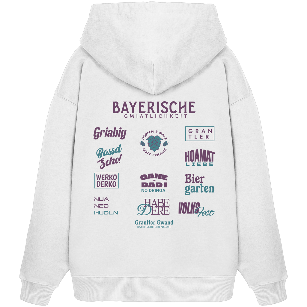 Weißer Oversize Hoodie mit großem lila Backprint „Bayerische Gmiatlichkeit“ und bayerischen Begriffen wie Hoamatliebe, Biergarten, Volksfest, Grantler, Hopfen & Malz und Griabig. Unisex Premium-Hoodie aus Bio-Baumwolle im modernen Streetwear-Style. Designed und bedruckt in Bayern von Grantler Gwand.