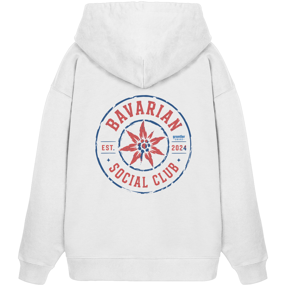 Weißer Oversize Hoodie mit großem roten und blauen „Bavarian Social Club“-Backprint sowie Edelweiß-Motiv im Vintage-Streetwear-Design.