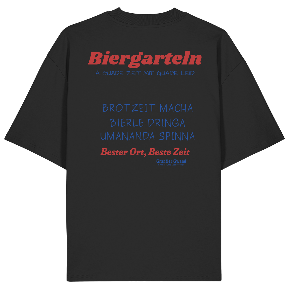 Schwarzes Oversize Unisex T-Shirt mit großem Biergarteln Backprint in Rot und bayerischem Statement „A guade Zeit mit guade Leid“. Schweres Premium-Shirt für Biergarten, Volksfest, Stammtisch und moderne bayerische Streetwear. Designed und bedruckt in Bayern von Grantler Gwand.