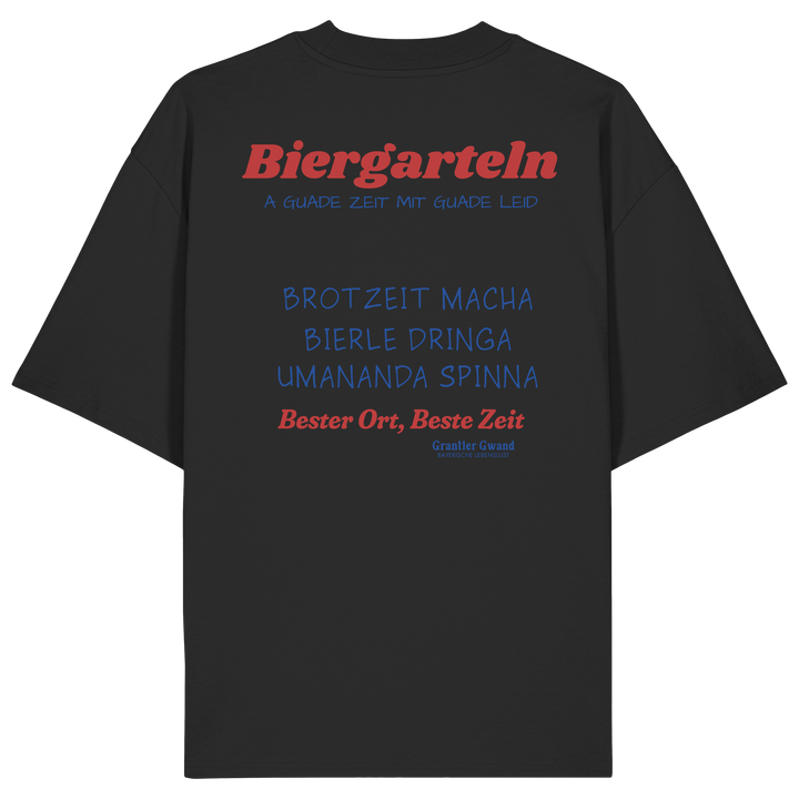 Schwarzes Oversize Unisex T-Shirt mit großem Biergarteln Backprint in Rot und bayerischem Statement „A guade Zeit mit guade Leid“. Schweres Premium-Shirt für Biergarten, Volksfest, Stammtisch und moderne bayerische Streetwear. Designed und bedruckt in Bayern von Grantler Gwand.