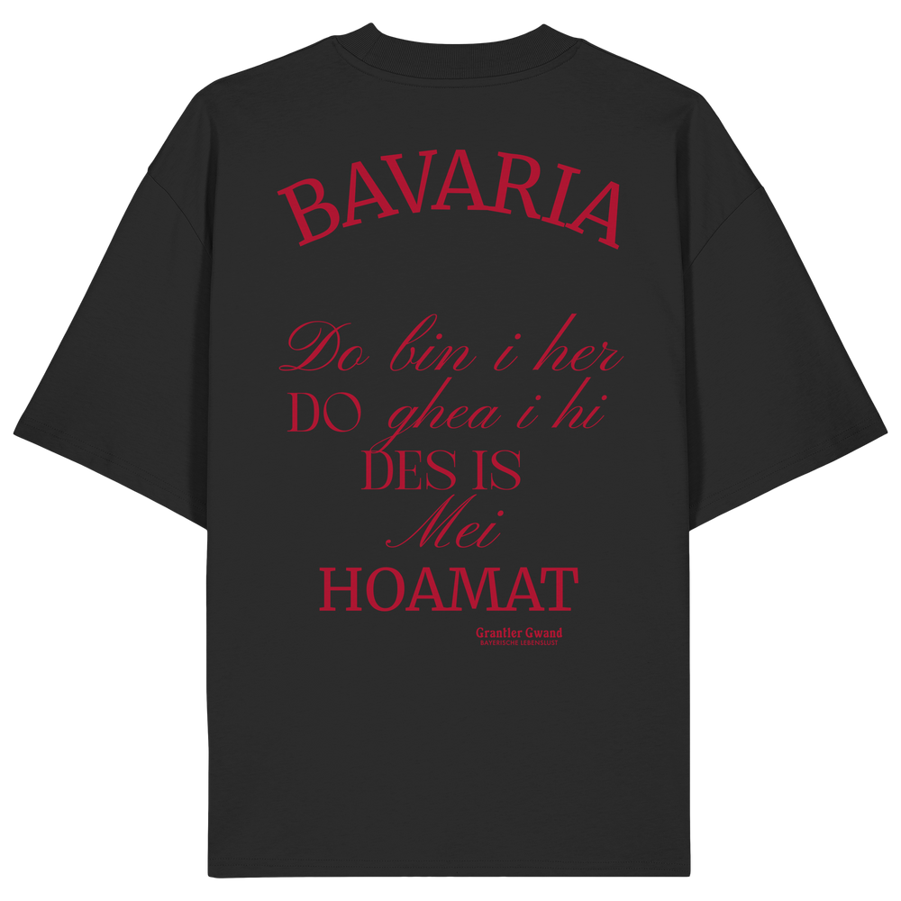 Schwarzes Oversize Shirt mit großem Backprint „Bavaria – Do bin i her. Do ghea i hi. Des is mei Hoamat.“ in elegantem Typografie-Design.