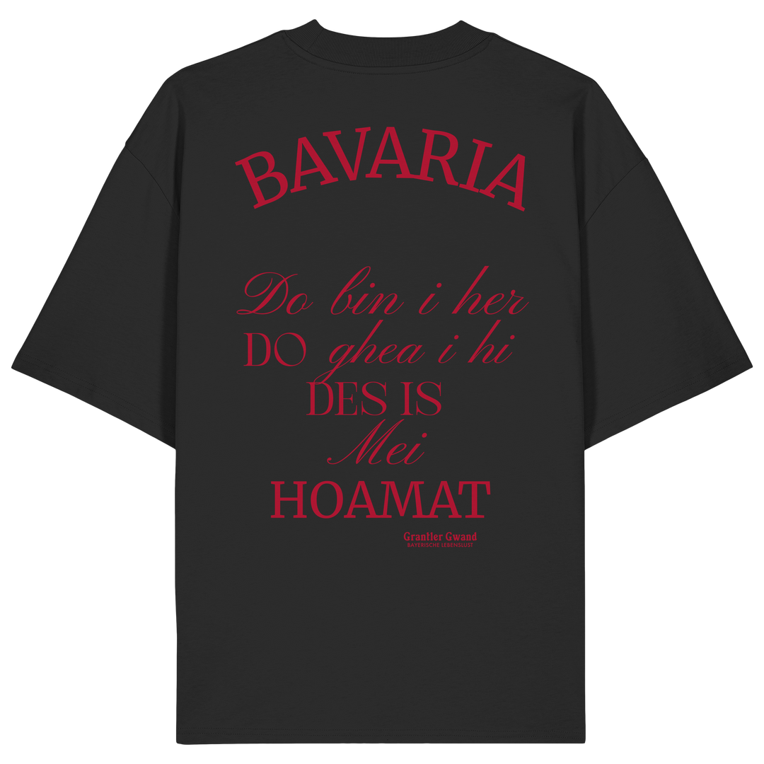 Schwarzes Oversize Shirt mit großem Backprint „Bavaria – Do bin i her. Do ghea i hi. Des is mei Hoamat.“ in elegantem Typografie-Design.