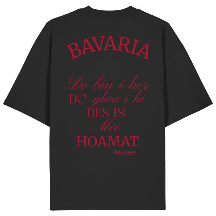 Schwarzes Oversize Shirt mit großem Backprint „Bavaria – Do bin i her. Do ghea i hi. Des is mei Hoamat.“ in elegantem Typografie-Design.