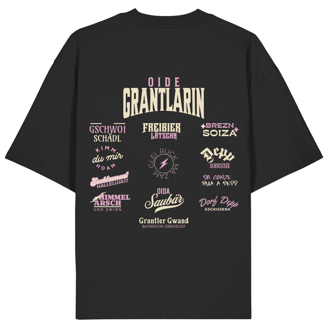 Schwarzes Oversize Shirt mit großem Backprint „Oide Grantlarin“ und verschiedenen bayerischen Dialektbegriffen wie Gschwoi Schädl, Freibier Låtschn, Brezn Soiza, Oida Saubär und Dorf Depp von Grantler Gwand.