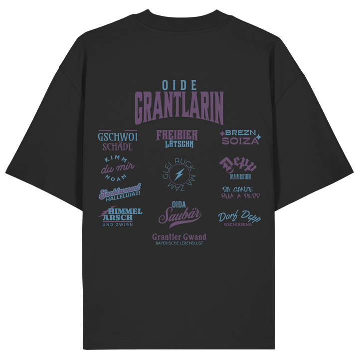 Schwarzes Oversize Shirt mit großem Backprint „Oide Grantlarin“ und verschiedenen bayerischen Dialektbegriffen wie Gschwoi Schädl, Freibier Låtschn, Brezn Soiza, Oida Saubär und Dorf Depp von Grantler Gwand.