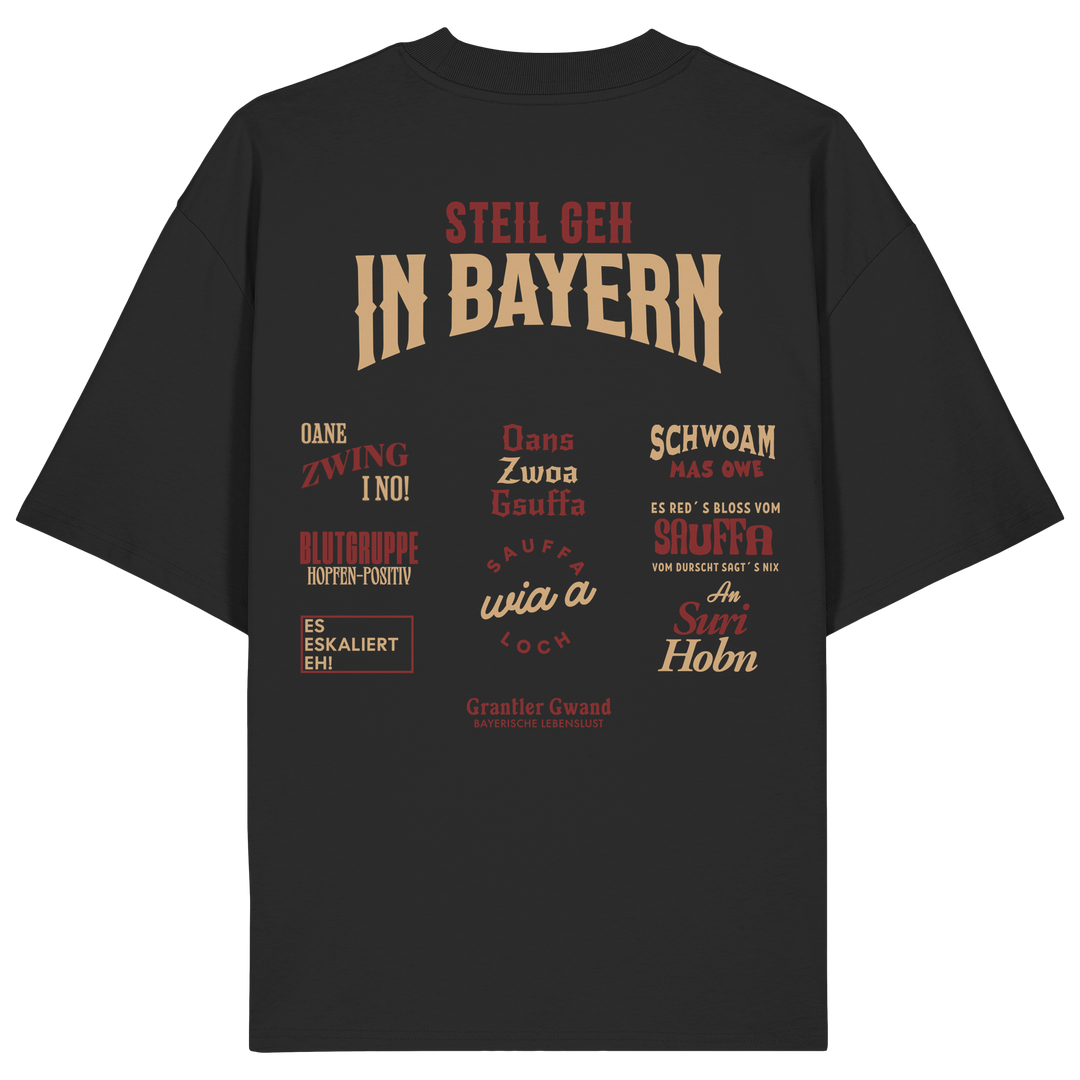 Schwarzes Oversize T-Shirt mit großem Backprint aus mehreren bayerischen Dialektsprüchen im modernen Typografie-Design von Grantler Gwand.