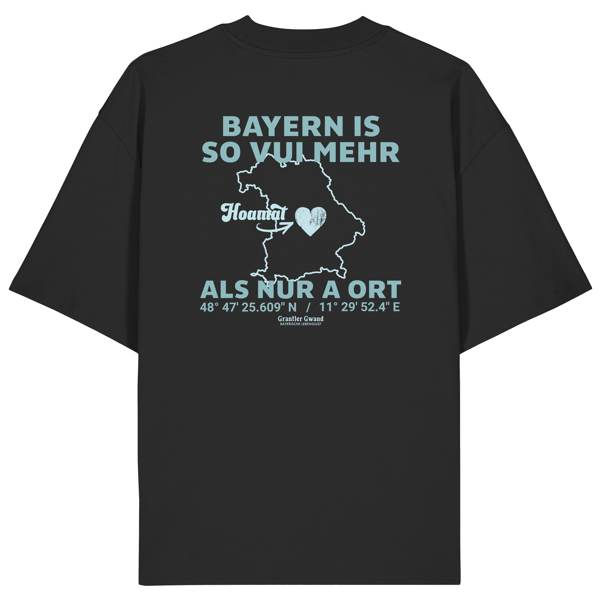 Schwarzes Oversize T-Shirt von Grantler Gwand mit grünem Backprint „Bayern is so vui mehr als nur a Ort“ und Bayern-Silhouette – bayerisches Streetwear Shirt aus Bio-Baumwolle.