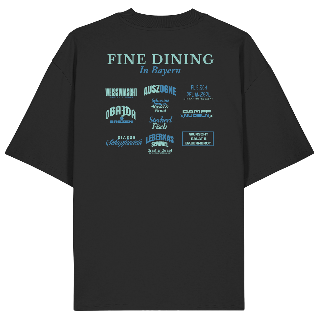 Schwarzes Oversize-T-Shirt in bio Qualität mit grünem „Fine Dining in Bayern“-Backprint – bayerische Streetwear mit humorvollem Motiv rund um bayerische Küche von Grantler Gwand.