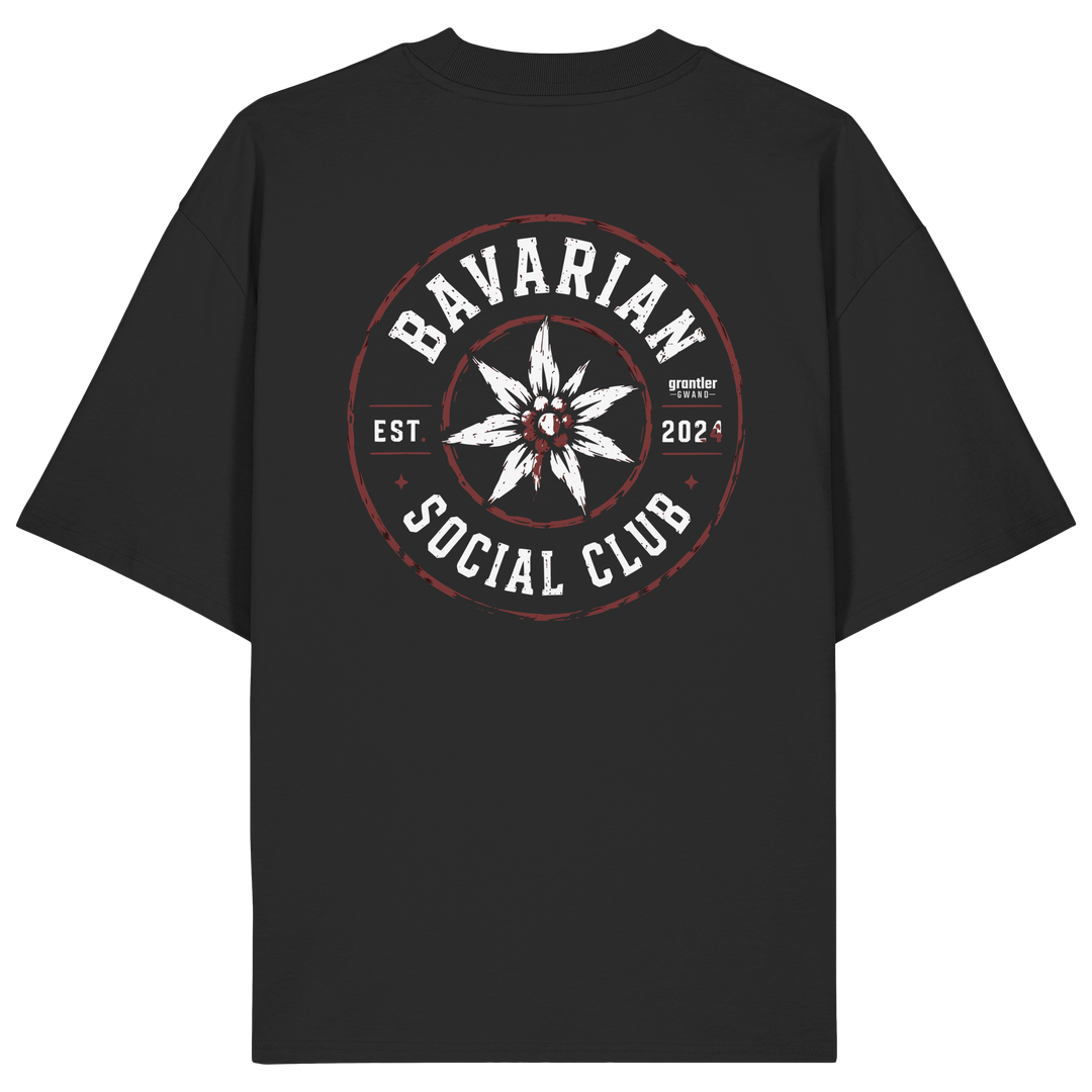 Schwarzes Oversize T-Shirt mit großem „Bavarian Social Club“-Backprint, weißem Edelweiß in der Mitte sowie Vintage-Details in Weiß und Dunkelrot.