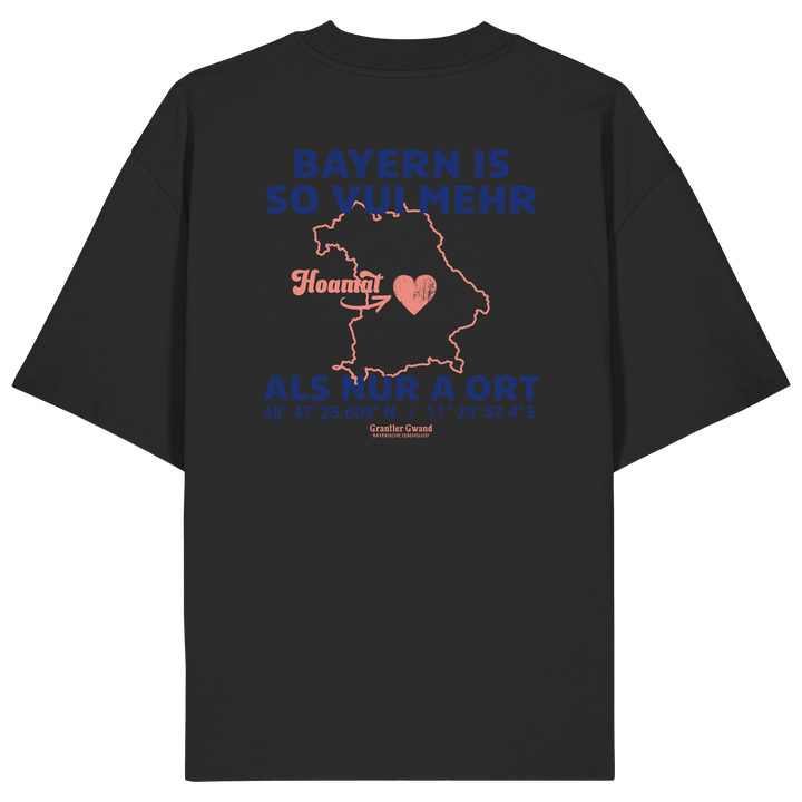 Schwarzes Oversize T-Shirt von Grantler Gwand mit blauem Backprint „Bayern is so vui mehr als nur a Ort“, Herzsymbol und Bayern-Silhouette – bayerisches Streetwear Shirt aus Bio-Baumwolle.