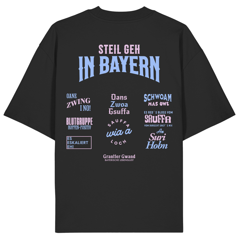Schwarzes Oversize T-Shirt mit großem Backprint aus mehreren bayerischen Dialektsprüchen im modernen Typografie-Design von Grantler Gwand.