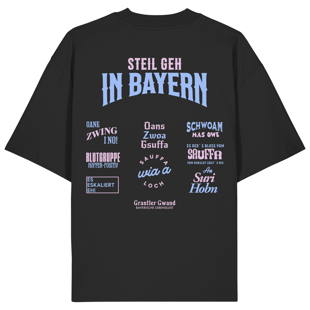 Schwarzes Oversize T-Shirt mit großem Backprint aus mehreren bayerischen Dialektsprüchen im modernen Typografie-Design von Grantler Gwand.