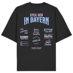 Schwarzes Oversize T-Shirt mit großem Backprint aus mehreren bayerischen Dialektsprüchen im modernen Typografie-Design von Grantler Gwand.