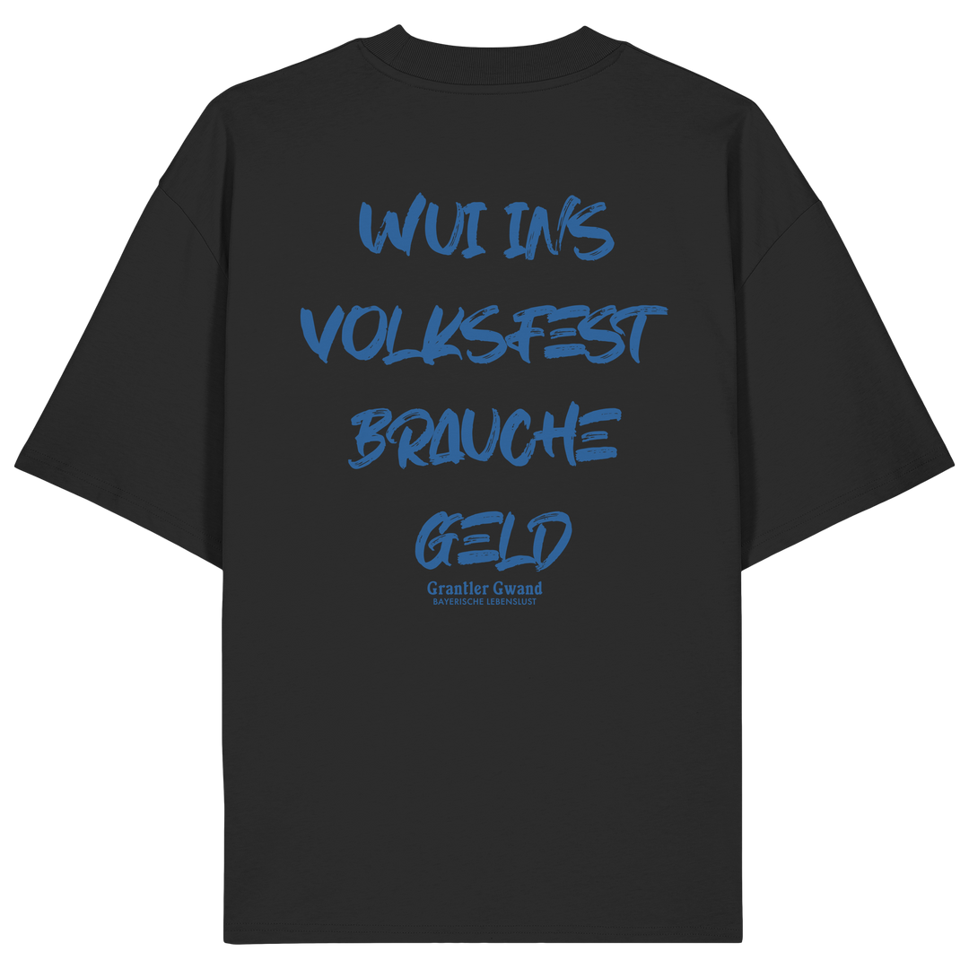 Schwarzes Oversize T-Shirt von Grantler Gwand mit blauem Backprint „Wui ins Volksfest – brauche Geld“ in markanter Brush-Schrift – bayerisches Streetwear Shirt aus Bio-Baumwolle.