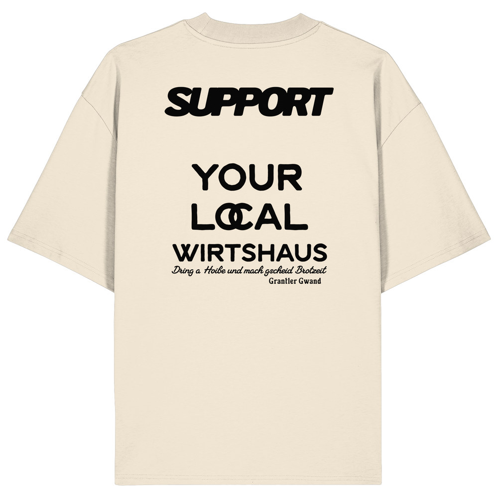 „Beiges Oversize T-Shirt mit schwarzem Backprint 'Support Your Local Wirtshaus' im markanten Typografie-Design von Grantler Gwand.“