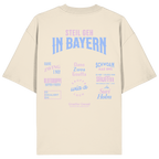 Naturfarbenes Oversize T-Shirt mit großem Backprint aus mehreren bayerischen Dialektsprüchen im modernen Typografie-Design von Grantler Gwand.
