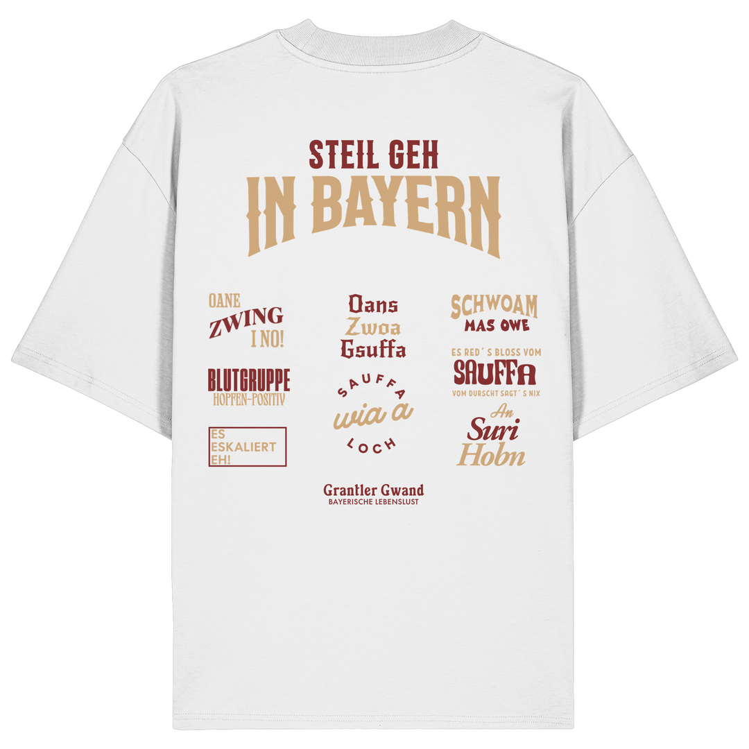 Weißes Oversize T-Shirt mit großem Backprint aus mehreren bayerischen Dialektsprüchen im modernen Typografie-Design von Grantler Gwand.