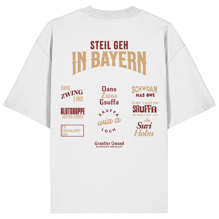 Weißes Oversize T-Shirt mit großem Backprint aus mehreren bayerischen Dialektsprüchen im modernen Typografie-Design von Grantler Gwand.