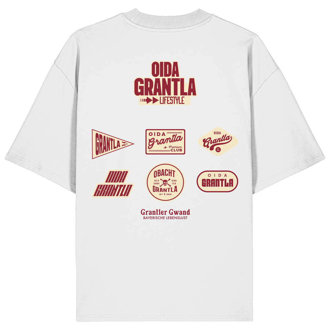 Weißes Oversize Shirt mit großem Oida Grantla Lifestyle Backprint aus mehreren Retro-Logos im bayerischen Streetwear-Design von Grantler Gwand.