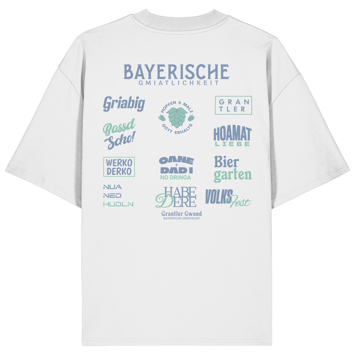 Weißes Bayerische Gmiatlichkeit Oversize Shirt mit großem grünem Backprint und bayerischen Begriffen wie Hoamatliebe, Biergarten, Volksfest, Grantler, Hopfen &amp; Malz und Griabig. Unisex Heavy Oversized T-Shirt aus Bio-Baumwolle im modernen Streetwear-Look. Designed und bedruckt in Bayern von Grantler Gwand.