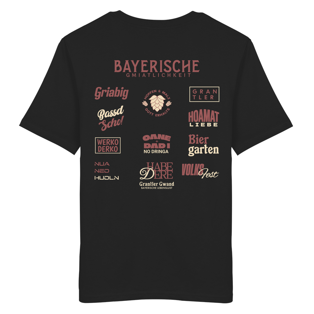 Schwarzes T-Shirt mit großem rotem Backprint „Bayerische Gmiatlichkeit“ und typischen bayerischen Begriffen wie Hoamatliebe, Biergarten, Volksfest, Grantler, Hopfen & Malz und Griabig. Unisex Premium-T-Shirt aus ringgesponnener Baumwolle im modernen Streetwear-Style. Designed und bedruckt in Bayern von Grantler Gwand.