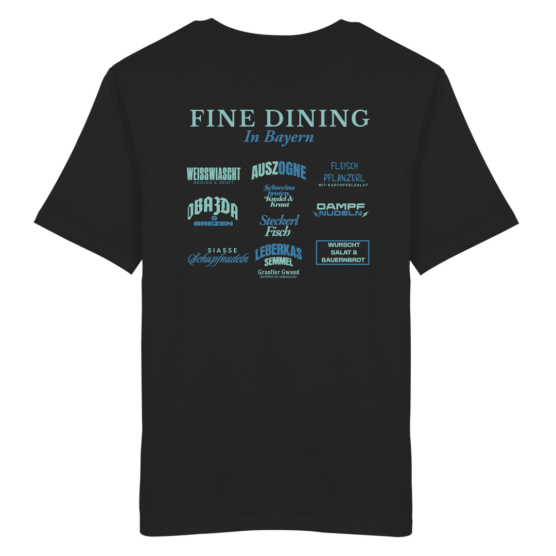 Schwarzes Unisex T-Shirt mit grünem „Fine Dining in Bayern“-Backprint – bayerische Streetwear mit typografischem Motiv rund um Leberkas, Brezen, Dampfnudeln und weitere Klassiker der bayerischen Küche.