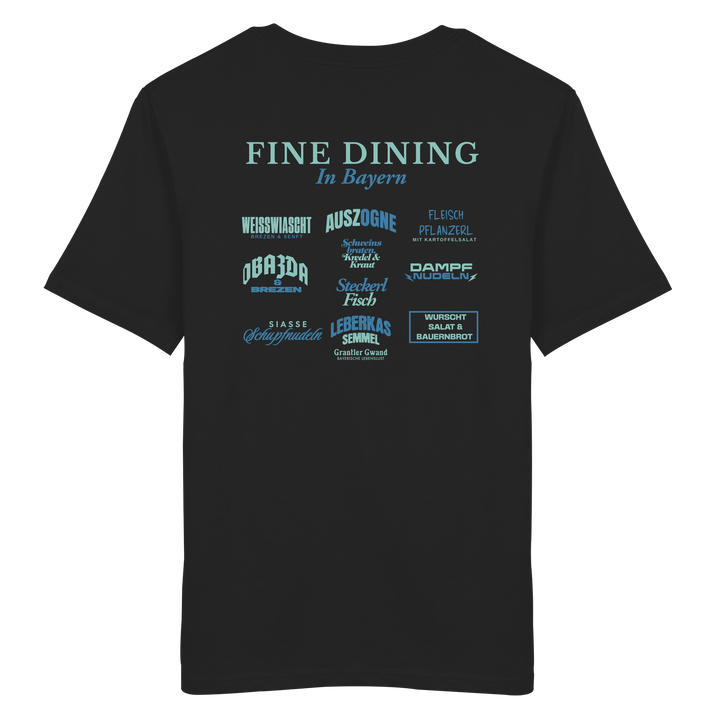 Schwarzes Unisex T-Shirt mit grünem „Fine Dining in Bayern“-Backprint – bayerische Streetwear mit typografischem Motiv rund um Leberkas, Brezen, Dampfnudeln und weitere Klassiker der bayerischen Küche.