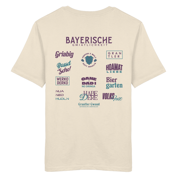 Beiges Unisex T-Shirt mit großem lila Backprint „Bayerische Gmiatlichkeit“ und typischen bayerischen Begriffen wie Hoamatliebe, Biergarten, Volksfest, Grantler, Hopfen &amp; Malz und Griabig. Unisex Premium-T-Shirt aus ringgesponnener Baumwolle im modernen Streetwear-Style. Designed und bedruckt in Bayern von Grantler Gwand.