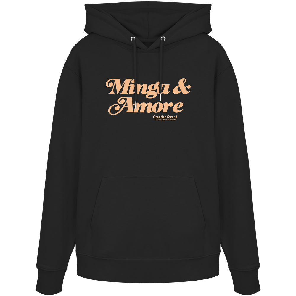 Schwarzer Unisex Hoodie von Grantler Gwand mit apricotfarbenem Frontprint „Minga & Amore“ im Retro-Schriftzug – bayerischer Streetwear Hoodie für Alltag, Biergarten und München.