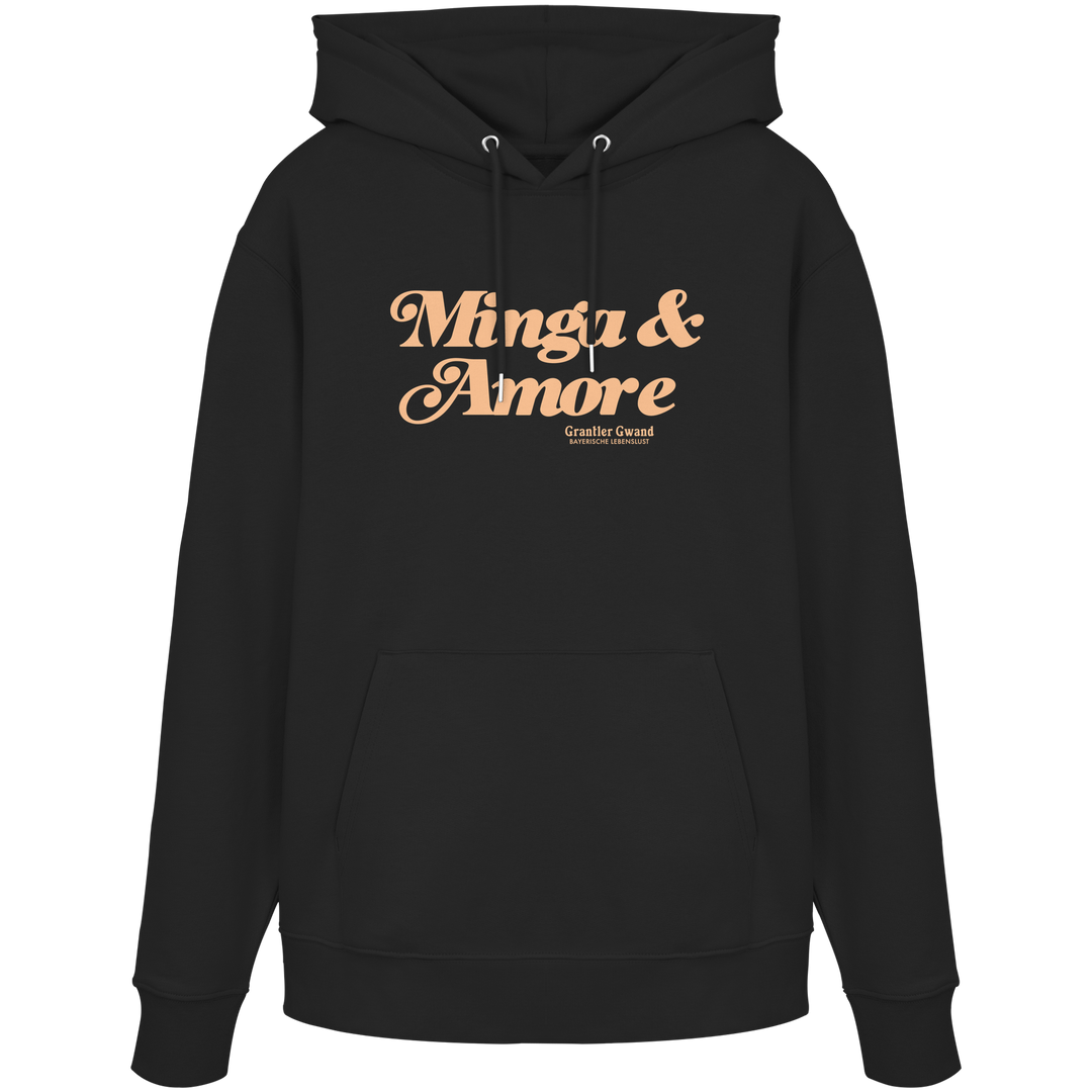 Schwarzer Unisex Hoodie von Grantler Gwand mit apricotfarbenem Frontprint „Minga &amp; Amore“ im Retro-Schriftzug – bayerischer Streetwear Hoodie für Alltag, Biergarten und München.