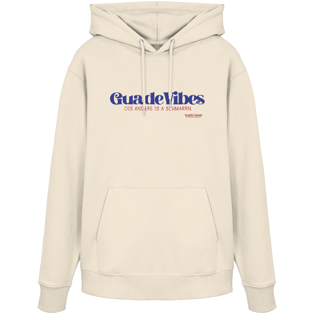Cremefarbener Unisex Hoodie mit blauem Frontprint „Guade Vibes – Ois andere is a Schmarrn“ – bayerischer Streetwear Hoodie mit modernem Dialekt-Spruch von Grantler Gwand.