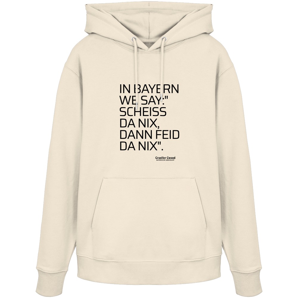 Naturfarbener Hoodie mit schwarzem Schriftzug "In Bayern we say: Scheiß da nix, dann feid da nix" im minimalistischen bayerischen Streetwear-Design von Grantler Gwand.